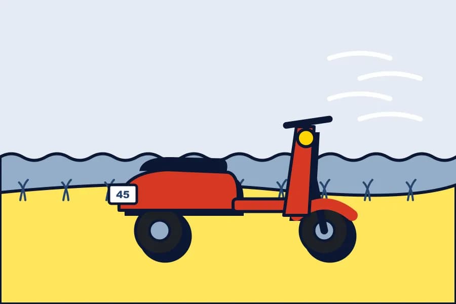 Roter Roller am Deich mit Gegenwind